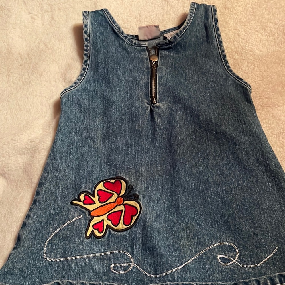 Butterscotch, size 4, denim with front zipper and yellow and red butterfly.